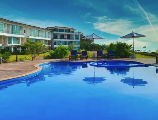 The seafront pool at The Beach Resort & Residence in Chumphon, with Koh Kye visible offshore.