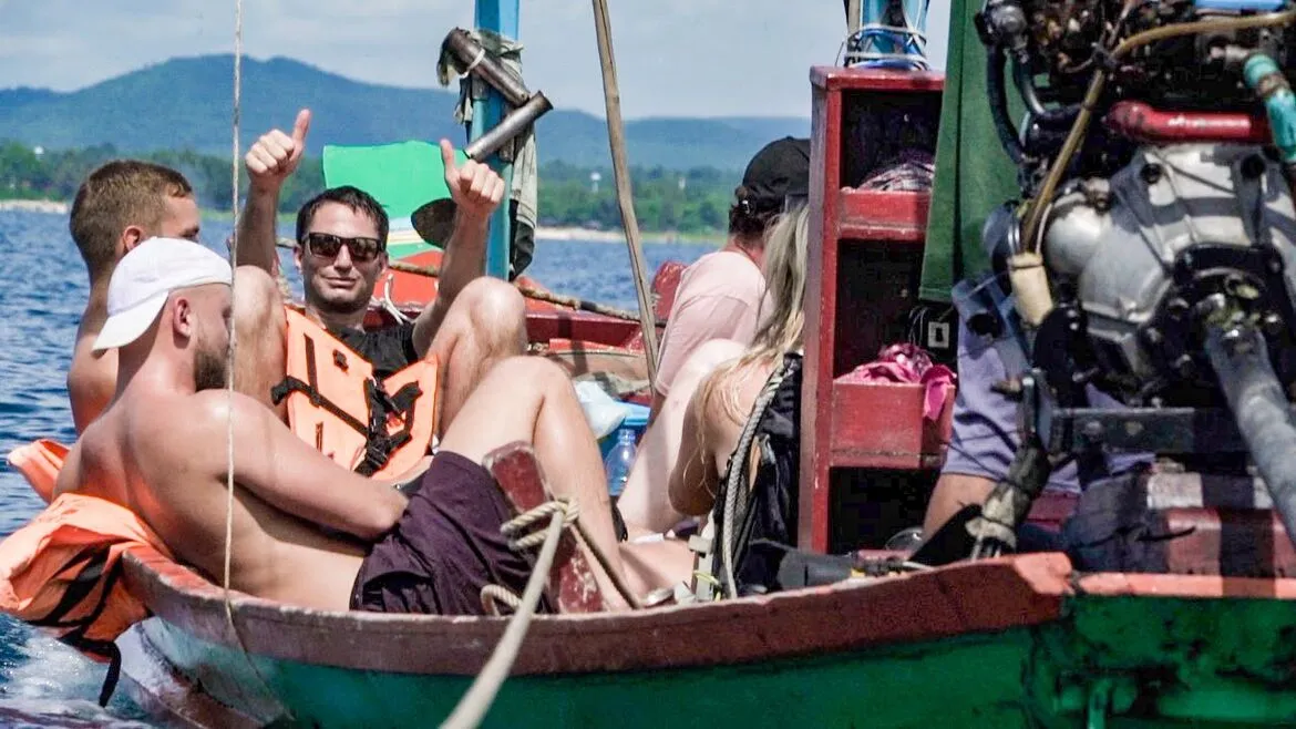 The group relaxing in the longtail boat on the crossing back to the mainland.